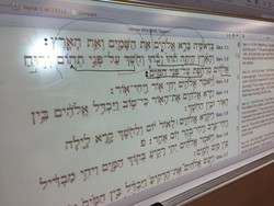 Adam Howell in the classroom showing Hebrew accents in Genesis 1